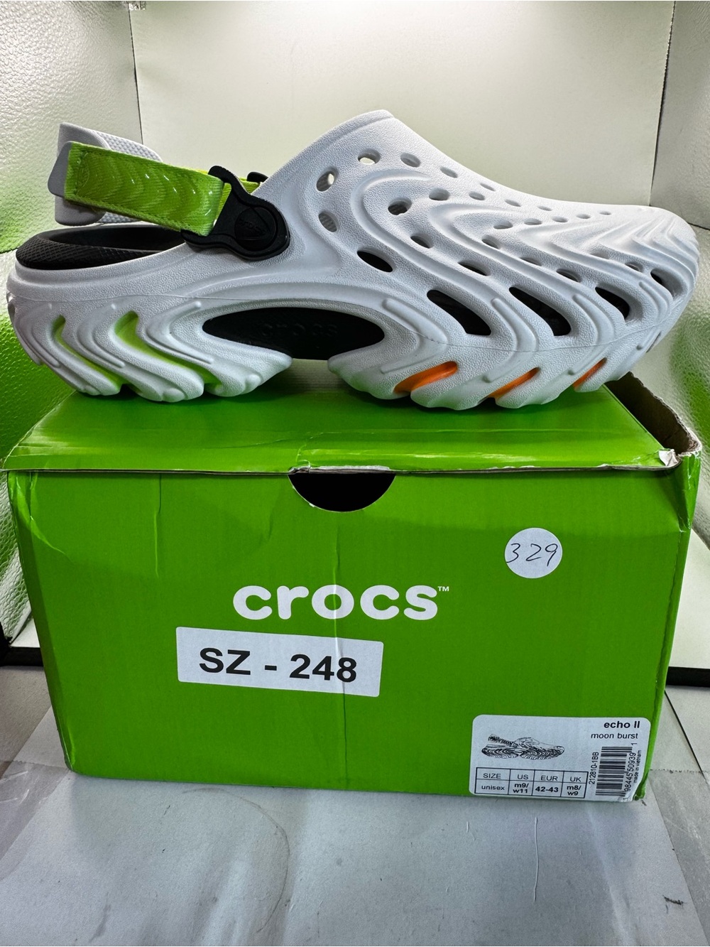 CROCS Kids White Clog with Green Strap and Orange Accents